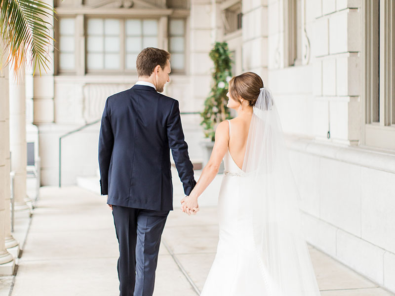 bride and groom walking in hotel