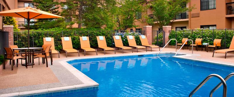 Select newport outdoor pool area with lounge chairs