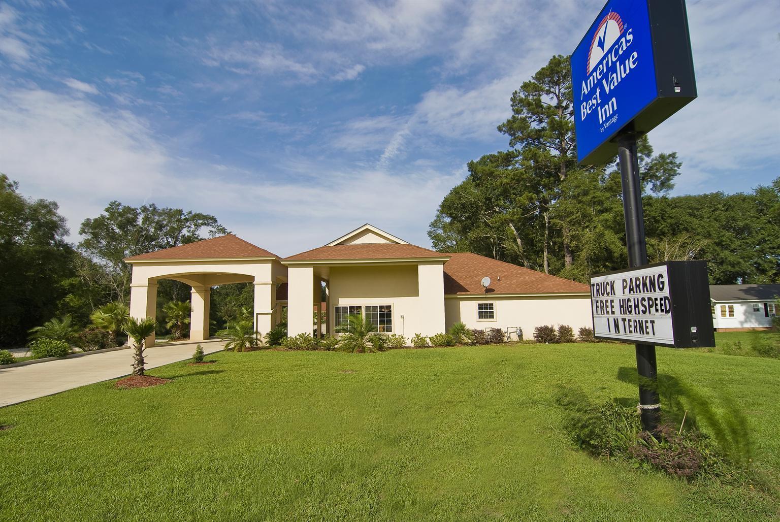 Exterior with large lawn and sign