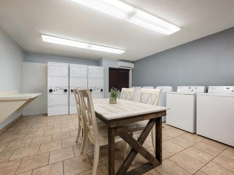 The laundry facility at Sonesta Simply Suites Huntsville Research Park.