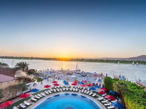 Sonesta St George Luxor Sunset Exterior of pool and river