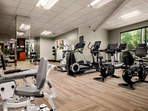 Modern fitness area in a bright room.
