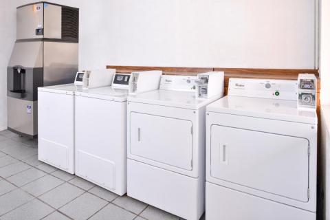 Guest laundry facility with coin-operated washer and dryer